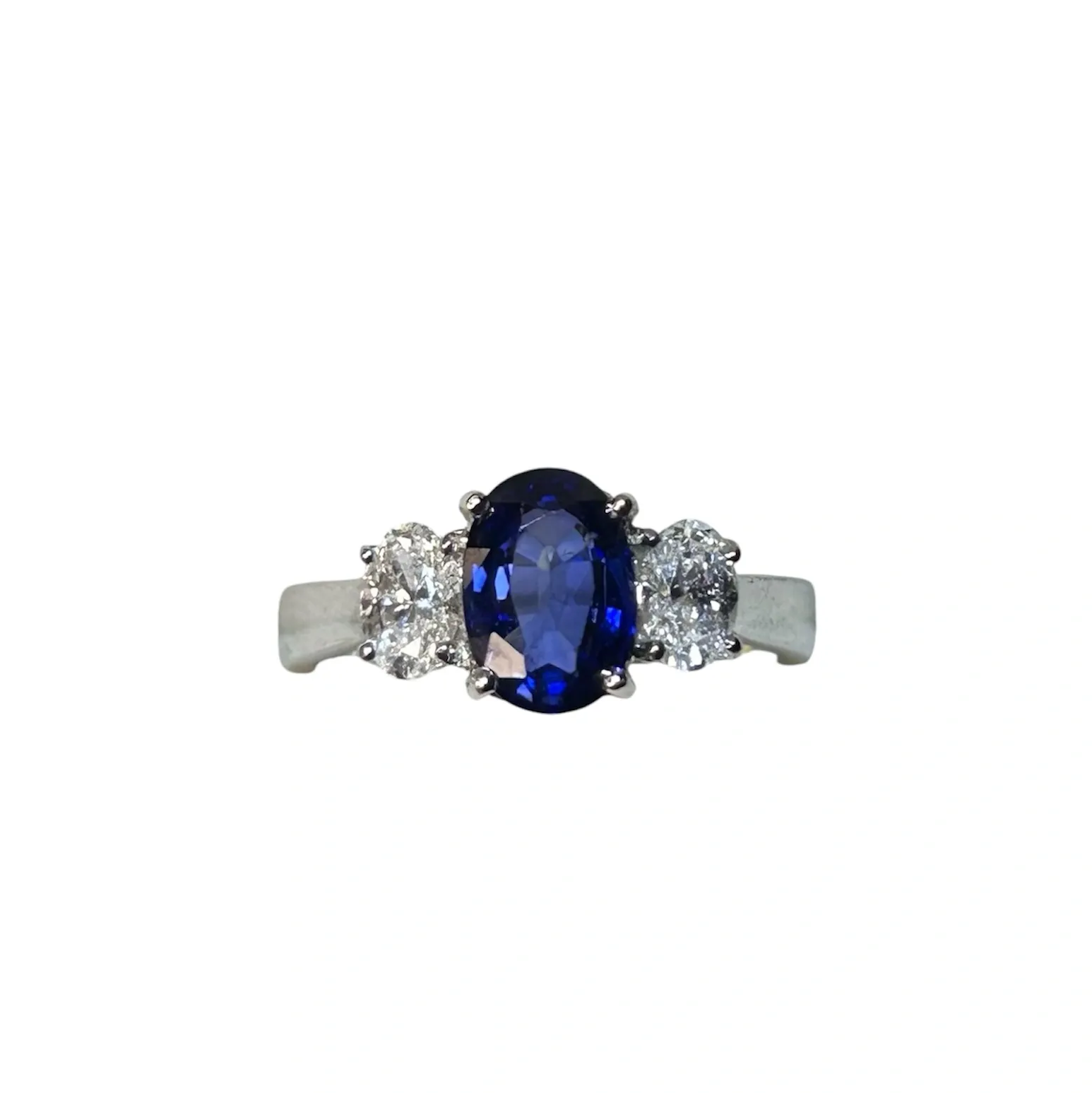 Oval sapphire ring with diamond halo